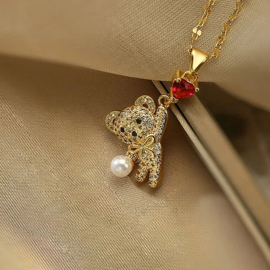 cadena de acero de titanio inoxidable con bonito oso lazo rojo